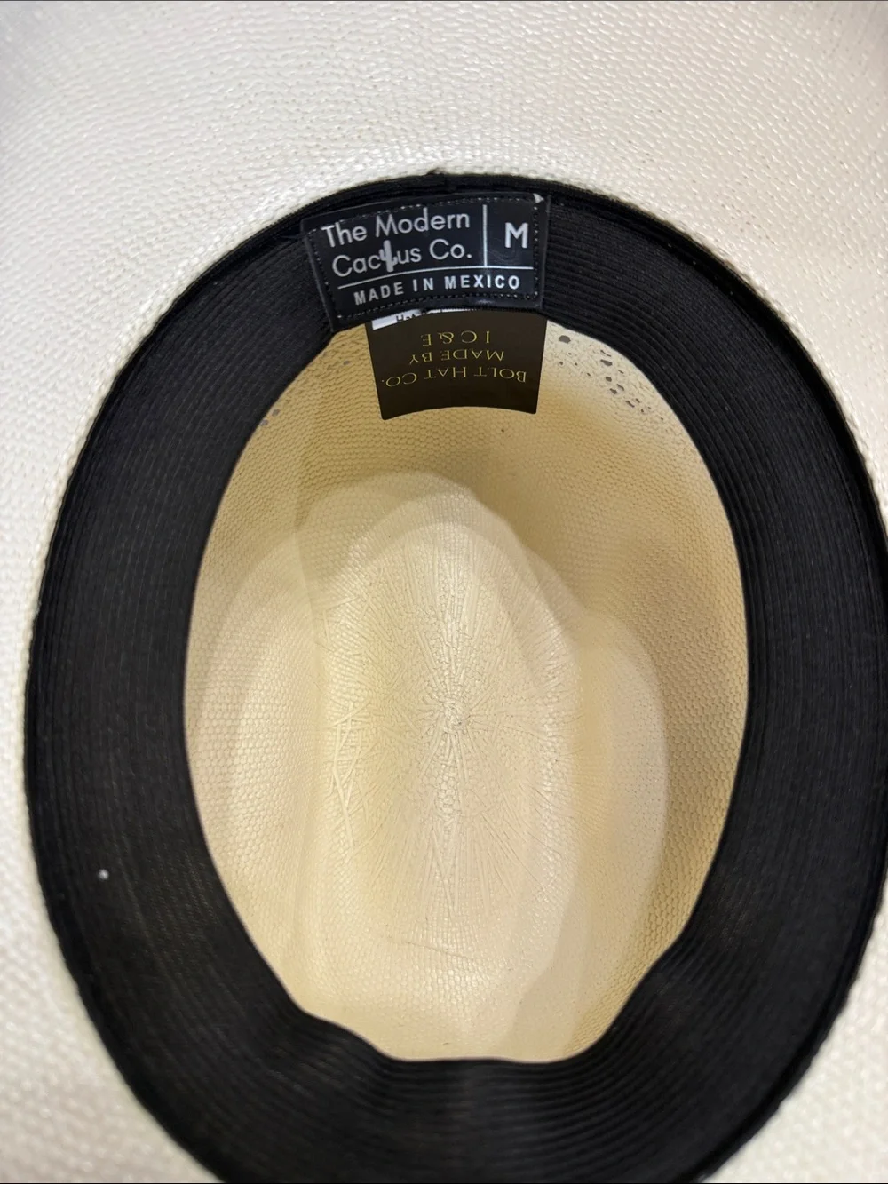 White Straw Cowboy Hat with Patriotic Red White and Blue Feathers.